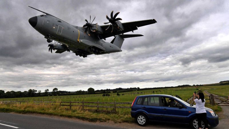 TOPSHOT - A Royal Air Force (RAF) Airbus A400M transport aircraft prepares to land at RAF Brize Norton, southern England, on August 18, 2021. - Britain has evacuated more than 2,000 Afghans in recent days, Prime Minister Boris Johnson told lawmakers recalled for an emergency debate on August 18, as he warned the Taliban must be judged "on actions, not words". Britain has sent hundreds of soldiers back to Afghanistan to help with repatriations and evacuations following the rapid Taliban takeover of the country. Officials aim to take 1,200 to 1,500 people from Afghanistan a day, with the several flights having landed at RAF Brize Norton over the last few days. (Photo by JUSTIN TALLIS / AFP)