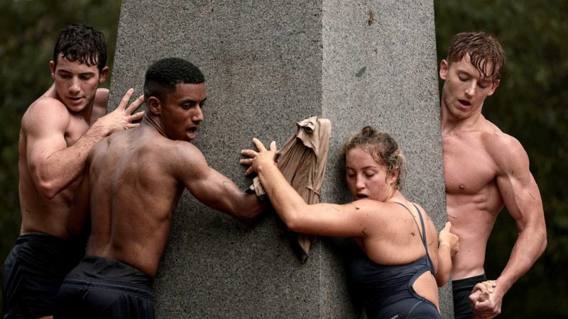 ANNAPOLIS, MARYLAND - AUGUST 22: Members of the 2023 midshipmen's class from the U.S. Naval Academy work to scale the Herndon Monument and place an upperclassman’s hat on the 21-foot obelisk on August 22, 2021 in Annapolis, Maryland. The class of 2023 resumed the 70-year tradition of replacing a Dixie cup sailor's cap atop the monument with an upperclassman’s hat following cancellation in 2020 due to the Covid-19 pandemic.   Anna Moneymaker/Getty Images/AFP  == FOR NEWSPAPERS, INTERNET, TELCOS & TELEVISION USE ONLY ==