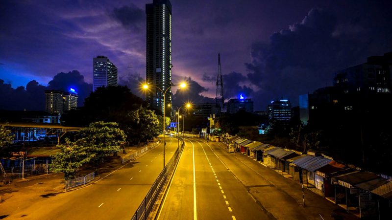 A view of a deserted street is pictured during a nationwide ten-day lockdown imposed to curb the spread of the Covid-19 coronavirus in Colombo on August 23, 2021. (Photo by Ishara S. KODIKARA / AFP)