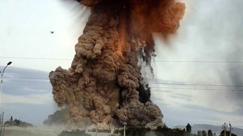 This screen grab from AFP TV video made on August 26, 2021 shows explosions at a defence ministry ammunitions depot in the southern region of Jambyl, about 30kms from Taraz, Kazakhstan. - The death toll following explosions at an arms depot in southern Kazakhstan rose to 12 on August 27, 2021, the Central Asian country's emergencies ministry said. A search had uncovered the bodies of a further three staff who were helping to put out the fire that began on August 26, 2021 evening, spokesman said. (Photo by Fyodor LOKTEV / AFP)