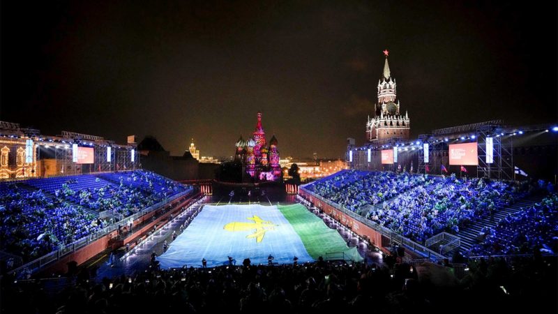 Russian Paratroopers military band carry their huge flag after performing during the Spasskaya Tower International Military Music Festival in Red Square with the St. Basil Cathedral in the background in Moscow, Russia, Thursday, Aug. 26, 2021. (AP Photo/Alexander Zemlianichenko)