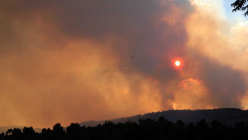 (210815) -- JERUSALEM, Aug. 15, 2021 (Xinhua) -- Smoke caused by wildfire is seen near Jerusalem on Aug. 15, 2021. Huge wildfire near Jerusalem sent thick black clouds over the city on Sunday as hundreds of firefighters were struggling to subdue the fire, Israeli authorities said. At least 10,000 people have been evacuated from their homes in the Jerusalem area, a spokesperson with the Jerusalem police said in a statement. (Photo by Muammar Awad/Xinhua)