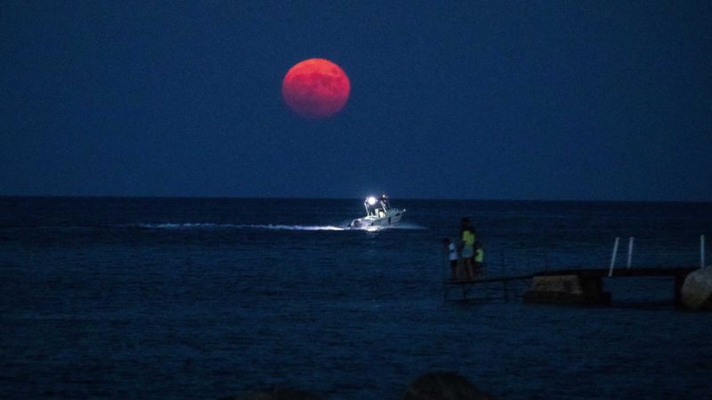 (210822) -- PROTARAS (CYPRUS), Aug. 22, 2021 (Xinhua) -- A full moon is seen in the sky over Protaras, Cyprus, on Aug. 22, 2021. (Photo by George Christophorou/Xinhua)