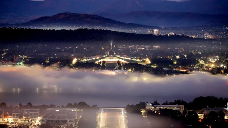 CANBERRA, Aug. 15, 2021 (Xinhua) -- Photo taken on Aug. 15, 2021 shows the Parliament House in thick fog in Canberra, Australia. (Xinhua/Liu Changchang)