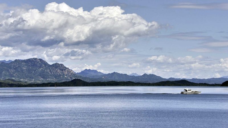 (210825) -- BEIJING, Aug. 25, 2021 (Xinhua) -- A monitoring ship patrols in the Miyun Reservoir in Beijing, capital of China, Aug. 25, 2021. As of 8 a.m. Beijing time on Tuesday, the water storage volume of the Miyun Reservoir in Beijing reached 3.371 billion cubic meters, a record high.
 Built in 1960, the reservoir has a total storage capacity of 4.375 billion cubic meters. (Xinhua/Li Xin)