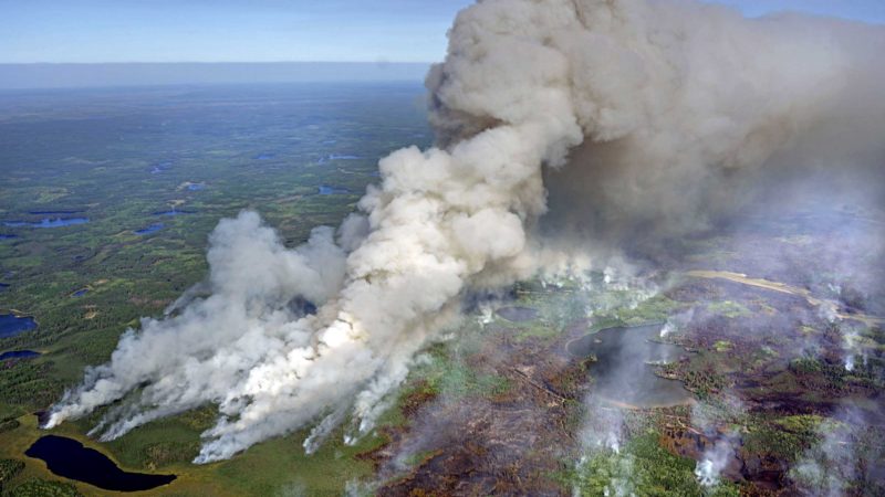 As the Greenwood Fire continues to burn, smoke from the blaze fills the air near Pitcha Lake (bottom left)  as fire crews set back fires to better control the perimeter, Wednesday, Aug. 25, 2021, in Isabella, Minn. (Brian Peterson/Star Tribune via AP)