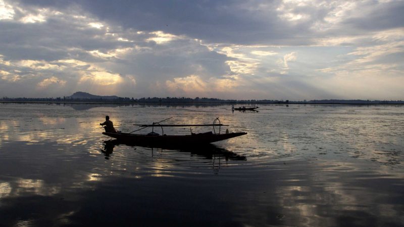 A Kashmiri fisherman rows his boat homeward after a day's work on the Dal Lake in Srinagar, Indian controlled Kashmir, Thursday, Sept. 9, 2021. (AP Photo/Mukhtar Khan)