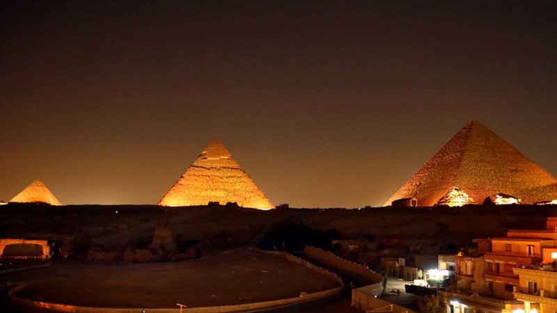 GIZA (EGYPT), Sept. 27, 2021 (Xinhua) -- A sound and light show is staged for tourists at the pyramids site in Giza, Egypt, on Sept. 27, 2021. Egypt's world-famous pyramids site, including the three Great Pyramids of Giza and the Sphinx, regained over 50 percent of the number of visitors that used to frequent the site before the outbreak of COVID-19 pandemic, said the director of the site in an interview with Xinhua on the occasion of the World Tourism Day. (Xinhua/Sui Xiankai) TO GO WITH Interview: Egypt's pyramids site regains 50 pct of visitors under COVID-19 measures: 