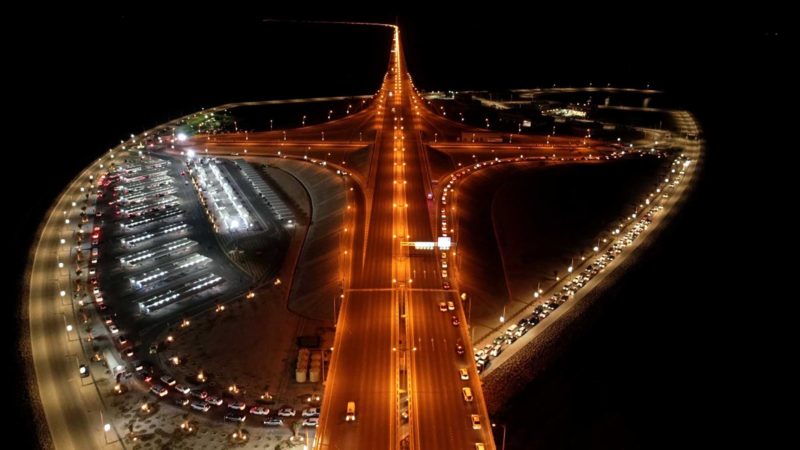 KUWAIT CITY, Sept. 8, 2021 (Xinhua) -- Aerial photo taken on Sept. 7, 2021 shows cars lining up on the road near a drive-thru vaccination center to receive COVID-19 vaccine in Kuwait City, Kuwait. (Photo by Asad/Xinhua)