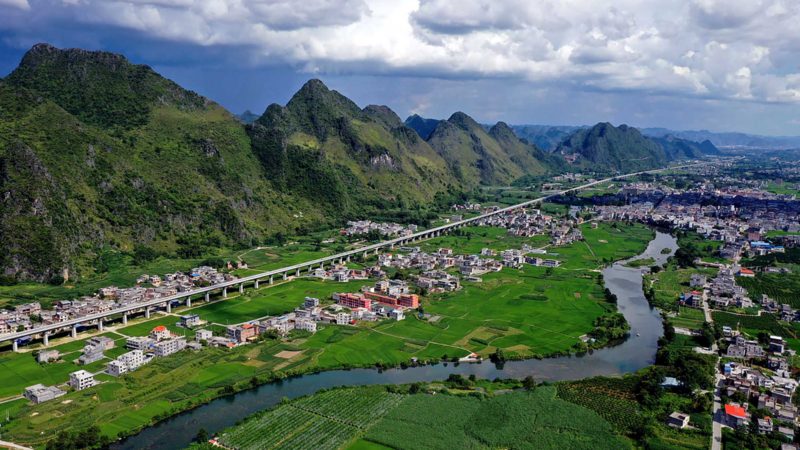 (210901) -- DU'AN, Sept. 1, 2021 (Xinhua) -- Aerial photo taken on Aug. 31, 2021 shows the countryside scenery of Gaoling Township in Du'an Yao Autonomous County, south China's Guangxi Zhuang Autonomous Region. Local authorities have made constant efforts in building infrastructural facilities, protecting the environment and improving living conditions. (Xinhua/Lu Boan)