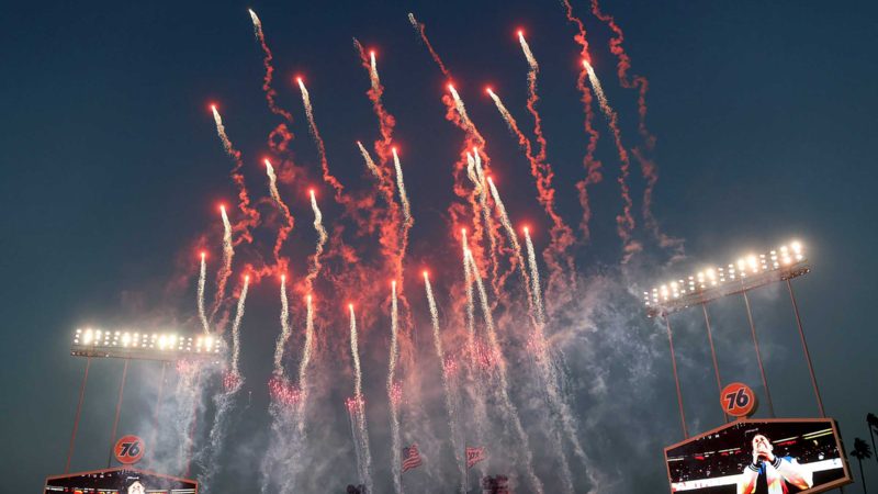 LOS ANGELES, CALIFORNIA - OCTOBER 11: Fireworks explode during the national anthem before game 3 of the National League Division Series between the Los Angeles Dodgers and the San Francisco Giants at Dodger Stadium on October 11, 2021 in Los Angeles, California.   Harry How/Getty Images/AFP  == FOR NEWSPAPERS, INTERNET, TELCOS & TELEVISION USE ONLY ==