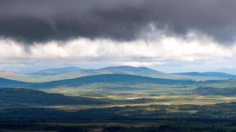 A photo taken on August 25, 2021 shows a view over Norrbotten County in Sweden from the outskirts of the town of Kiruna. - In the Arctic in Sweden's far north, global warming is happening three times faster than in the rest of the world. (Photo by Jonathan NACKSTRAND / AFP)