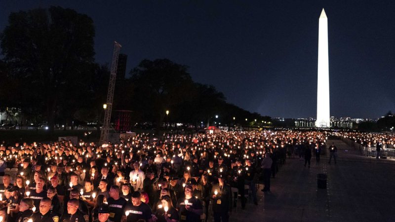 Hundreds of candles are held up during the National Law Enforcement Officers Memorial Fund's Annual Candlelight Vigil, on the National Mall, Thursday, Oct. 14, 2021, in Washington. (AP Photo/Alex Brandon)