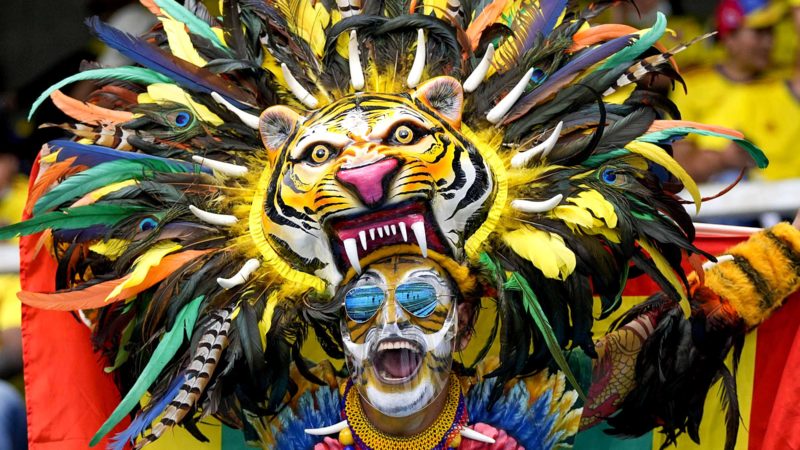 A fan of Colombia cheers prior to a qualifying soccer match for the FIFA World Cup Qatar 2022 between Colombia and Brazil in Barranquilla, Colombia, Sunday, Oct. 10, 2021. (AP Photo/Fernando Vergara)