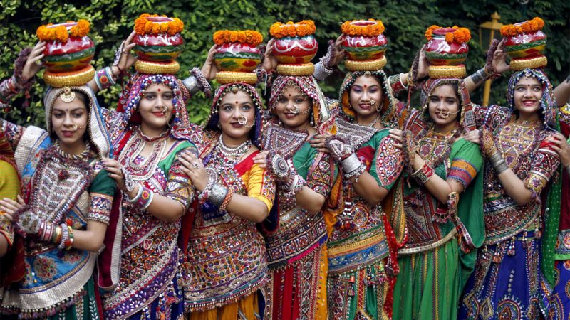 Indian women in traditional attire pose for photographs before practicing Garba, a traditional dance of Gujarat state, ahead of Hindu festival of Navratri in Ahmadabad, India, Friday, Oct. 1, 2021. The Hindu festival of Navratri or nine nights will begin from Oct. 7.  (AP Photo/Ajit Solanki)