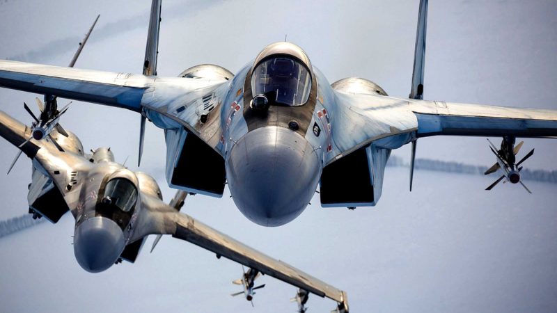 In this photo released by the Russian Defense Ministry Press Service, a pair of Russian Su-35 fighter jets fly in the sky in Russia, Sunday, Nov. 28, 2021. The Ukrainian and Western officials have expressed concern that a Russian military buildup near Ukraine could signal plans by Moscow to invade its ex-Soviet neighbor. (Russian Defense Ministry Press Service via AP)