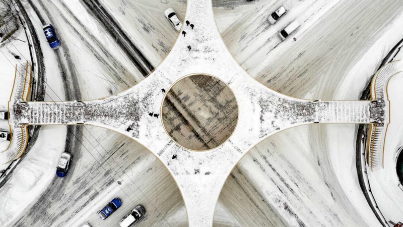 Aerial photo taken on Nov. 22, 2021 shows a snow-covered road intersection in Jixi City, northeast China's Heilongjiang Province. Blizzards hit many parts of Heilongjiang on Monday. (Xinhua/Zhang Tao)