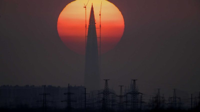 FILE - The Lakhta Centre tower under construction, the headquarters of Russian gas monopoly Gazprom, is silhouetted against the sunset in St. Petersburg, Russia, on April 15, 2018. Europe is short of gas. Russia could in theory supply more beyond its long-term agreements, but hasn't, leading to accusations it is holding back to pressure Europe to approve a new controversial Russian pipeline. (AP Photo/Dmitri Lovetsky, File)