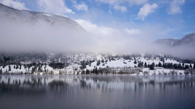 (211208) -- LAKE BOHINJ (SLOVENIA), Dec. 8, 2021 (Xinhua) -- Photo taken on Dec. 7, 2021 shows the winter landscape of Lake Bohinj in Triglav National Park, Slovenia. (Photo by Zeljko Stevanic/Xinhua)