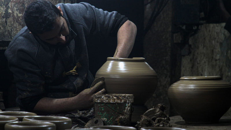 A Palestinian man works at one of the oldest pottery factory in Gaza City, on Dec. 8, 2021. (Photo/RSS)
